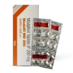 This image shows a box packaging for a medication called "Modafil MD 200", containing 200mg modafinil tablets manufactured by the Intas Pharmaceuticals Ltd company. The box features the company's logo and branding, along with key product details.